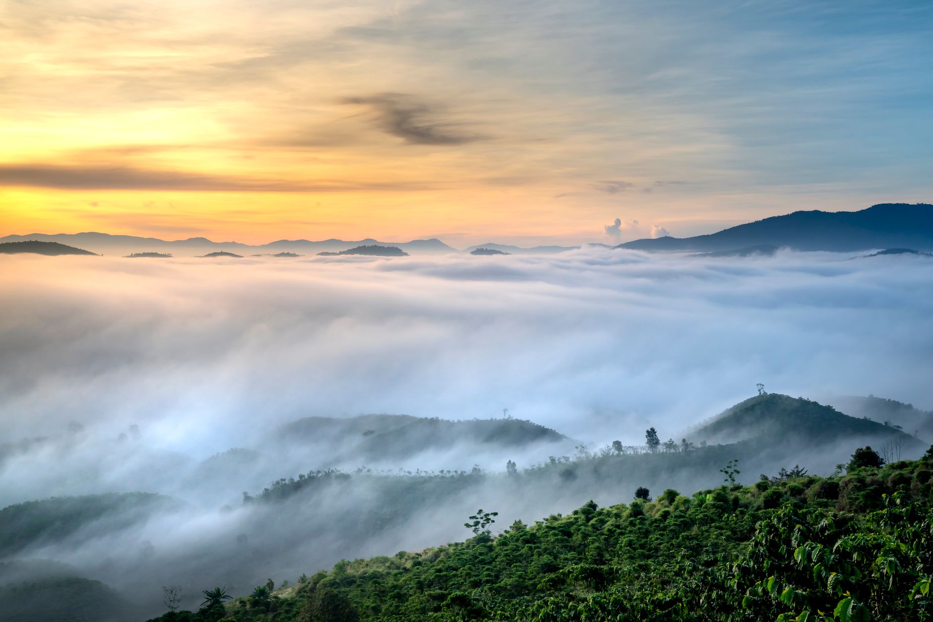 Panoramic misty mountain ridge landscape at sunrise